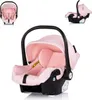 Three views of a pink baby car seat against a white background. Anteprima dell’immagine prodotto