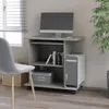 A computer desk with a monitor, computer tower, and chair in a room. Náhled obrázku produktu