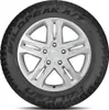 A Falken Wildpeak A/T tire mounted on a silver rim, shown from the front. Produktbild-Vorschau