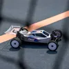 A remote-controlled buggy on a track. Anteprima dell’immagine prodotto