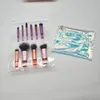 A set of makeup brushes and a cosmetic bag are displayed in a clear plastic package. Anteprima dell’immagine prodotto