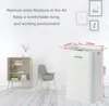 A white dehumidifier is shown in a room setting with a shelf and a chair. Anteprima dell’immagine prodotto