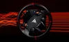 A gaming steering wheel with red light effects in the background. Anteprima dell’immagine prodotto