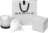 A white shopping bag with the BERING logo, a white drawstring pouch with the BERING logo, a white gift box with the BERING logo, and a frosted glass container with a black base, also with the BERING logo. Produktbild-Vorschau