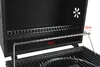 Close-up view of the interior of a black charcoal grill, showing two wire racks and measurement indicators. Produktbild-Vorschau