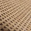 A close-up view of a woven rattan material, showing the texture and pattern of the weave. Podgląd zdjęcia produktu