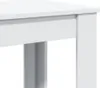 A close-up view of the corner of a white table, showing the edge and a leg. Náhľad obrázku produktu