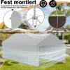 A grey tent garage with close-up insets showing assembly details and ground anchoring, set in a backyard with a house and trees in the background. Produktbild-Vorschau