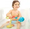 A young child playing with a bath toy in a bathtub. Anteprima dell’immagine prodotto