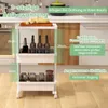 A white three-tier rolling cart with various items on its shelves, placed in a kitchen setting. Produktbild-Vorschau