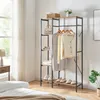 A bedroom corner with a wardrobe rack, bed, and window. Anteprima dell’immagine prodotto