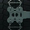 A close-up view of a tire with snow chains attached. Produktbild-Vorschau