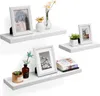 Three white floating shelves are displayed against a white background, each adorned with various decorative items. Anteprima dell’immagine prodotto