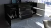 A modern black sideboard with open drawers and a cabinet door, placed in a well-lit room with a large window overlooking a city. Produktbild-Vorschau