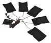 A set of five black heating pads connected by wires and a USB cable, laid out on a white background. Náhled obrázku produktu