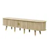 A long, low TV stand with a ribbed texture and golden accents on the legs and handles. Anteprima dell’immagine prodotto