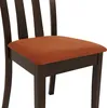 A close-up view of a dining chair with an orange seat and a dark brown wooden frame. Voir les images du produit