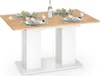 A dining table set for a meal, with place settings and a bottle of water. Voir les images du produit