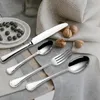 A table setting with cutlery, blueberries, and walnuts. Produktbild-Vorschau
