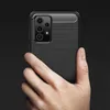 A hand holding a black smartphone case with a carbon fiber texture. Produktbild-Vorschau