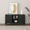 A black metal TV stand with two doors and open shelves, decorated with various items, placed in a room. Voir les images du produit