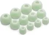A collection of green silicone earbud tips arranged on a white background. Produktbild-Vorschau