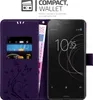 A purple wallet-style phone case with card slots and a phone inside, along with euro banknotes. Náhľad obrázku produktu