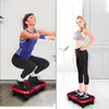 Two women are shown using a vibration plate for exercise. The left image shows a woman in a squatting position, and the right image shows a woman standing. Podgląd zdjęcia produktu