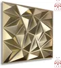 A 3D geometric wall panel with a metallic gold finish. Produktbild-Vorschau