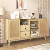 A light wood sideboard with rattan doors and drawers, decorated with various items. Anteprima dell’immagine prodotto