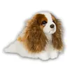 A plush toy King Charles Spaniel dog is shown lying down against a white background. Produktbild-Vorschau