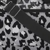 A close-up view of a bag with a leopard print pattern and a black strap. Anteprima dell’immagine prodotto