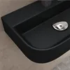 A close-up view of a black ceramic sink with a silver drain. Produktbild-Vorschau