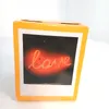 A product box with a picture of neon 'love' text on it. Produktbild-Vorschau