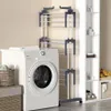 A laundry room scene with a washing machine and a drying rack. Produktbild-Vorschau