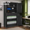 An office scene featuring a large black metal filing cabinet filled with binders, a desk with a laptop and lamp, and a green wall. Náhled obrázku produktu