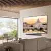 A modern living room with a large TV displaying a scenic view of Rome, a soundbar, and comfortable seating. Produktbild-Vorschau