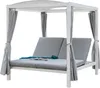 A white outdoor daybed with gray cushions and curtains.