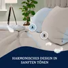 A bed with bedding and pillows, with decorative elements like feathers and a plant. Produktbild-Vorschau