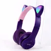 A pair of purple headphones with cat ears and LED lights. Náhľad obrázku produktu