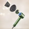 A green hairdryer with attachments is shown floating against a light, textured background with bokeh effects. Anteprima dell’immagine prodotto