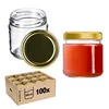 A collection of glass jars, some filled with red contents, and a cardboard box containing multiple jars. Anteprima dell’immagine prodotto