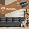 A dark gray sofa with decorative pillows and a throw blanket, set in a living room with a bookshelf in the background. Overlay text highlights product features. Voir les images du produit