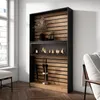 A modern living room with a fireplace unit against a wall, next to a window. Produktbild-Vorschau