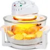 A halogen oven with a chicken and potatoes inside, on a white background. Podgląd zdjęcia produktu