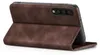A brown flip case for a smartphone is shown from a side angle, propped open. Produktbild-Vorschau