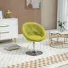 A lime green accent chair in a room setting. Produktbild-Vorschau