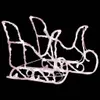 A white, stylized sleigh decoration with a black background. Podgląd zdjęcia produktu