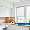 A modern kitchen with white cabinets, a wooden backsplash, and a window with a white roller blind. Produktbild-Vorschau