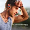 A man is exercising outdoors, wearing earbuds and wiping sweat from his forehead. Produktbild-Vorschau